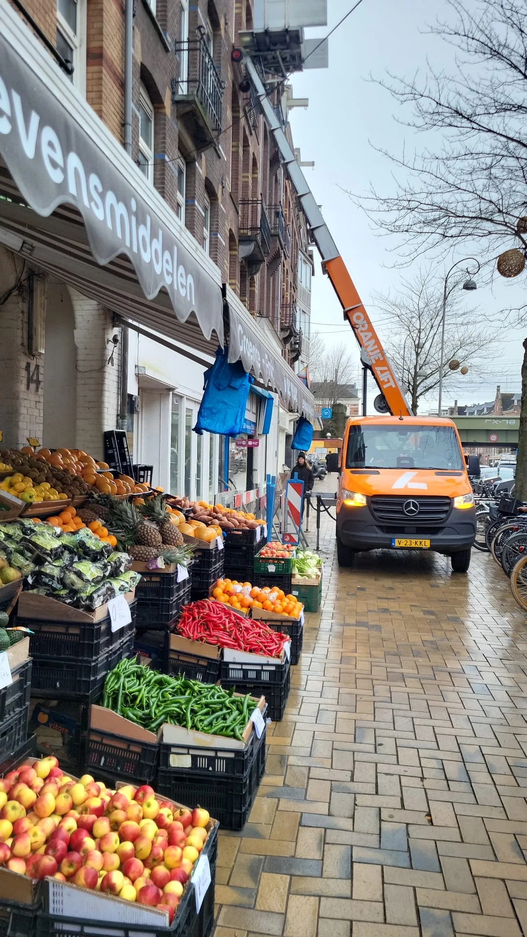 Furniture lift positioned on a narrow Amsterdam street